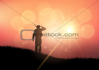 Soldier saluting at sunset 