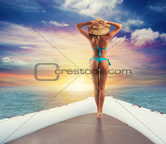 Girl relaxes on a inflatable boat at the sea