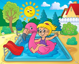 Girl floating on inflatable flamingo 2