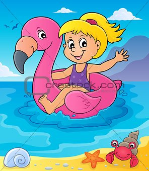 Girl floating on inflatable flamingo 4