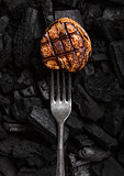 Grilled juicy beef pork steak on barbecue coil