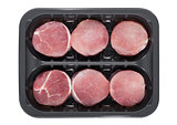 Raw round pork steak slices in plastic tray