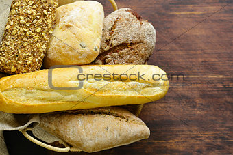 natural organic bread assortment on a wooden background