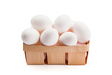White eggs in a box isolated on a white background