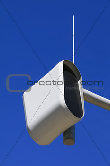 static speed or safety camera against a blue sky