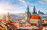 High spires towers of Tyn church in Prague city