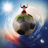 Football player exults in a soccer ball planet