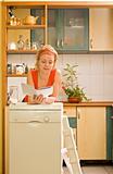 Woman with new kitchen appliance