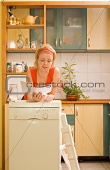 Woman with new kitchen appliance