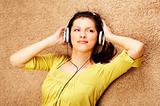 woman listening music in headphones