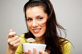 beautiful woman with cup of muesli