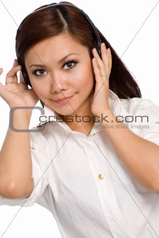 beautiful girl listening on headphones smiling