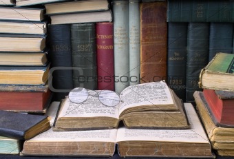 Very old books with glasses
