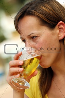 Woman dringink cold beer
