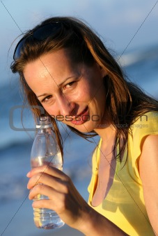 Woman holding bottle water