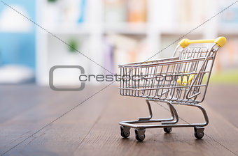 Miniature shopping cart on a desk