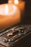 Precious old Bible and lit candles in the Church