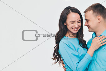 portrait of a man and a woman on a white background. Pair in blue