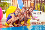 Happy kids near the pool