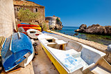 Colorful boat below Dubrovnik defense walls