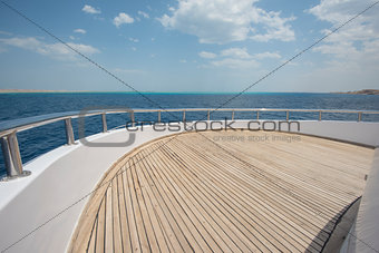 View over the bow over a large motor yacht