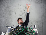 Businessman trapped by cables. concept of stress and overwork