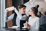 Guy and girl at a meeting in a cafe
