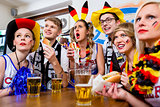 Soccer fans watching a game of the German national team