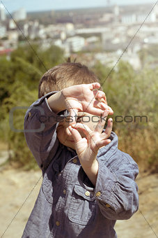 Boy pretending that he is a cameraman