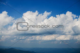 furry clouds on a blue sky on a beautiful summer