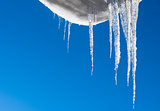 Hanging icicles with a blue sky background