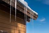 Icicles hanging from a building during winter