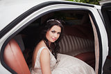 young beautiful caucasian bride woman in white car