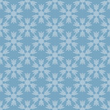 Seamless pattern with snowflakes on blue