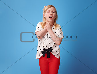modern child in red pants on blue with neck pain