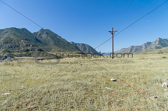 Small power line in the Altai mountains. Russia.