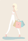 Young beautiful woman with shopping bags on light background