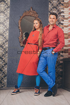 portrait of a man and a woman. Pair in red