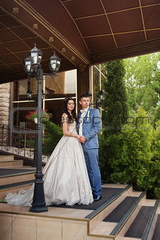 beautiful happy young bride and groom celebrating wedding outdoor