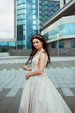 young beautiful bride outdoor on background of city