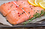 Raw Salmon Fish Fillet with Lemon, Spices and Fresh Herbs