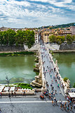 View of people walk on St Angel Bridge from Castel Sant'Angelo in Rome city