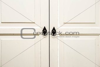 Vintage white wooden cupboard doors with metal handles