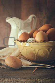 Fresh country eggs in bowl on table