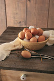 Fresh eggs on rustic wooden table