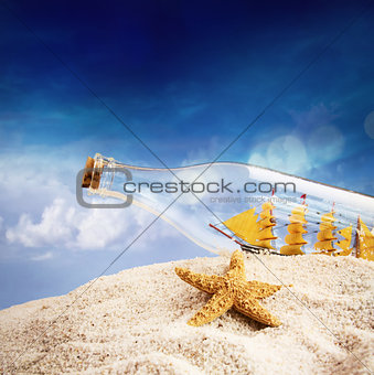 Ship in a bottle on the beach