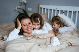 Mom and her two little cute daughters are having fun