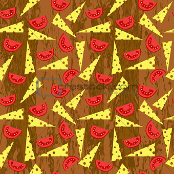 Cheese and tomato slices on wooden background
