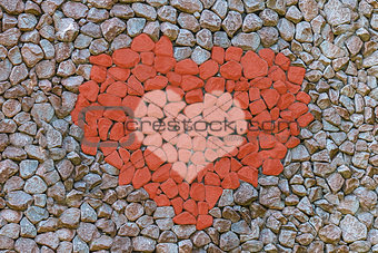 abstract background symbol of love red pink on a gray background stone canvas design a rough weather-beaten surface