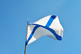 Naval flag of the Russian Navy St. Andrew on a blue sky